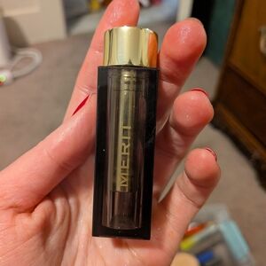 Merit Gold and Black Lipstick